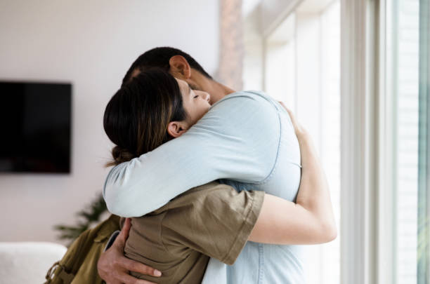 young man holding his Mother